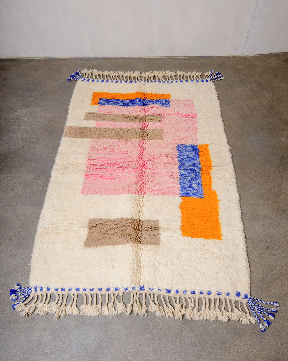 Modern, designer, handcrafted Berber rug from Morocco. Beniourain carpet with beautiful colours and patterns and fluffy wool texture.